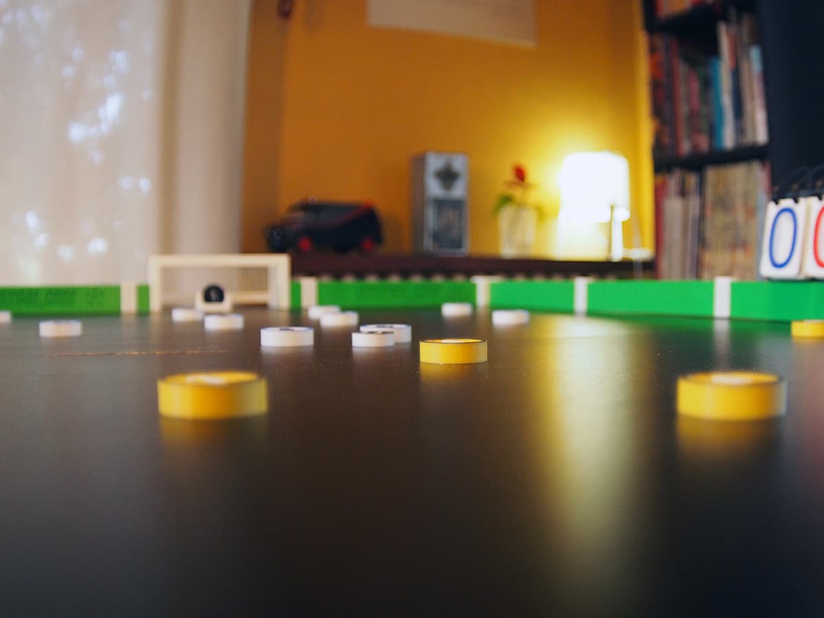 A GGx tabletop football match set up on a table at home.